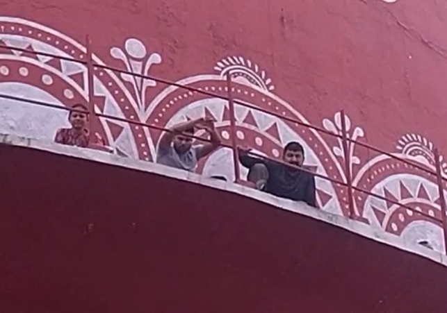 Nursing Sitting On Water Tank