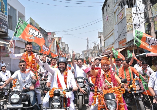 Holding the BJP  saffron flag in their hands