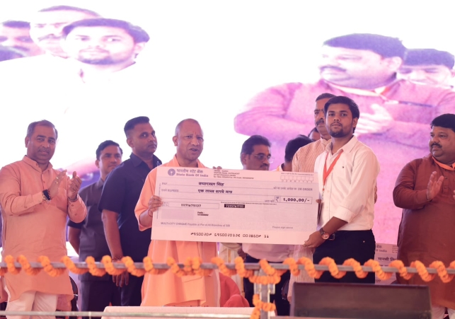 CM Yogi distributed cheques to beneficiaries