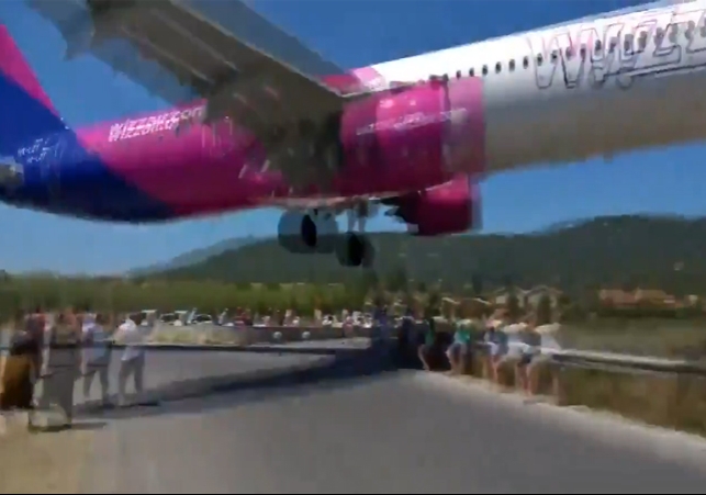 Greece Plane Fly Over The Heads of Tourists Video Viral