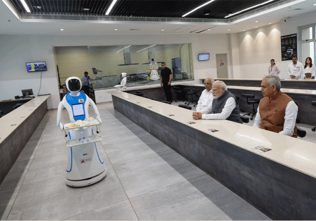  PM Modi with Robots Served Tea Sandwich in Gujarat Science City
