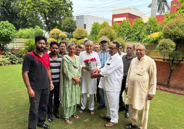 Delegation Presented a Bouquet and Wished