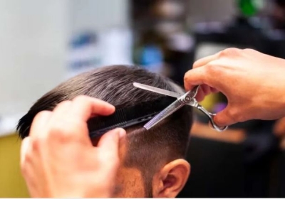 Teacher Cuts Children's Hair