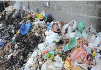 Garbage at the back side of the service station in Cabwala
