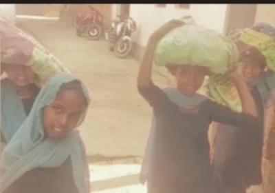 School principal uses children to carry heavy sackful of potatoes for mid-day meal 