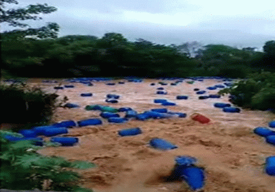 Due to heavy rain thousands of plastic drums flowed into the drain and river