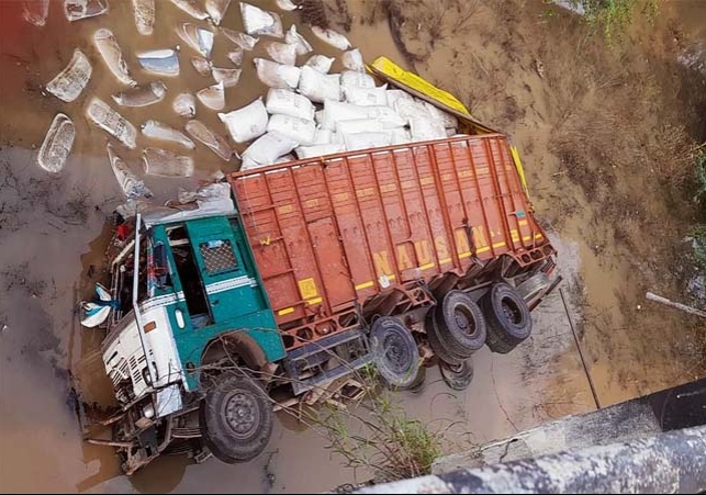 Truck Loaded with Dry Fruits Fell from Bridge Driver Died 