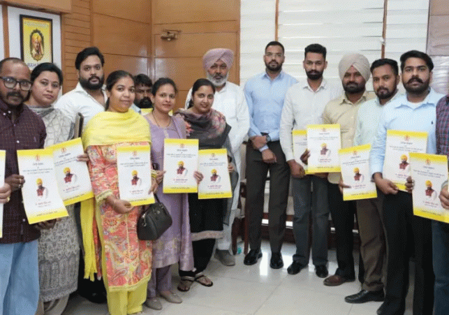 Finance Minister Harpal Cheema hands over appointment letters.